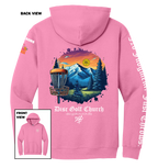 Pink hoodie with disc golf-themed design on the back, featuring mountains and trees, with 'Disc Golf Church' branding.