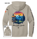 Beige hoodie with disc golf-themed design on the back, featuring mountains and trees, with 'Disc Golf Church' branding.