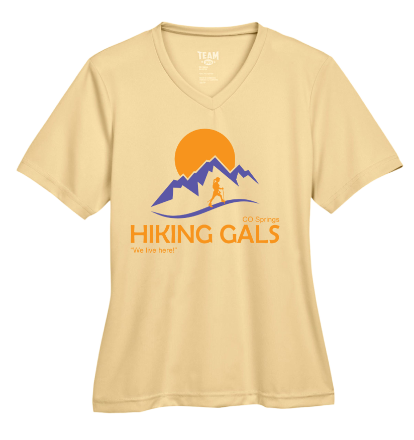 Beige t-shirt with 'Hiking Gals' graphic design featuring mountains and a sun.